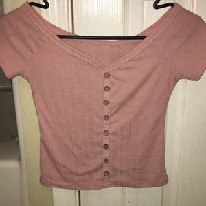 Pink shirt with decorative buttons